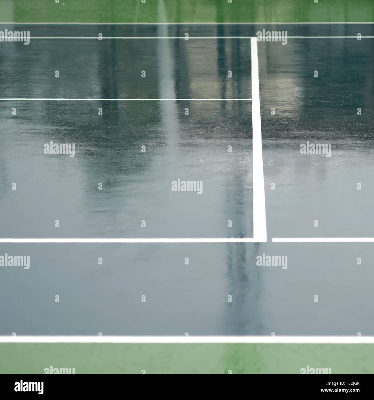 wet tennis court after the rain Stock Photo Alamy