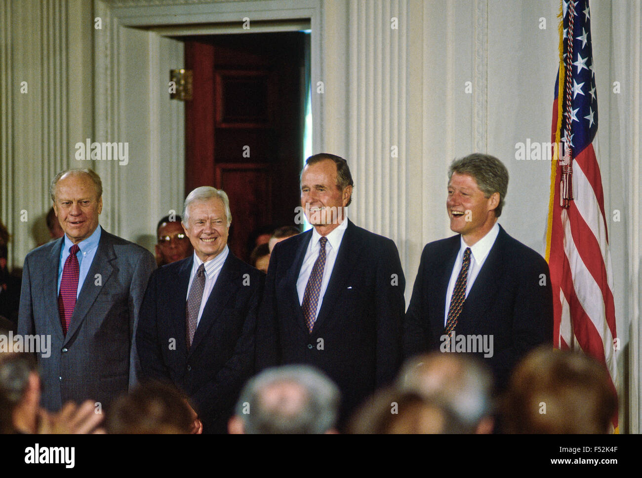 Former Presidents Ford, Carter, and Bush and current President Clinton attend the NAFTA signing ceremony in the East room of the White House. Stock Photo