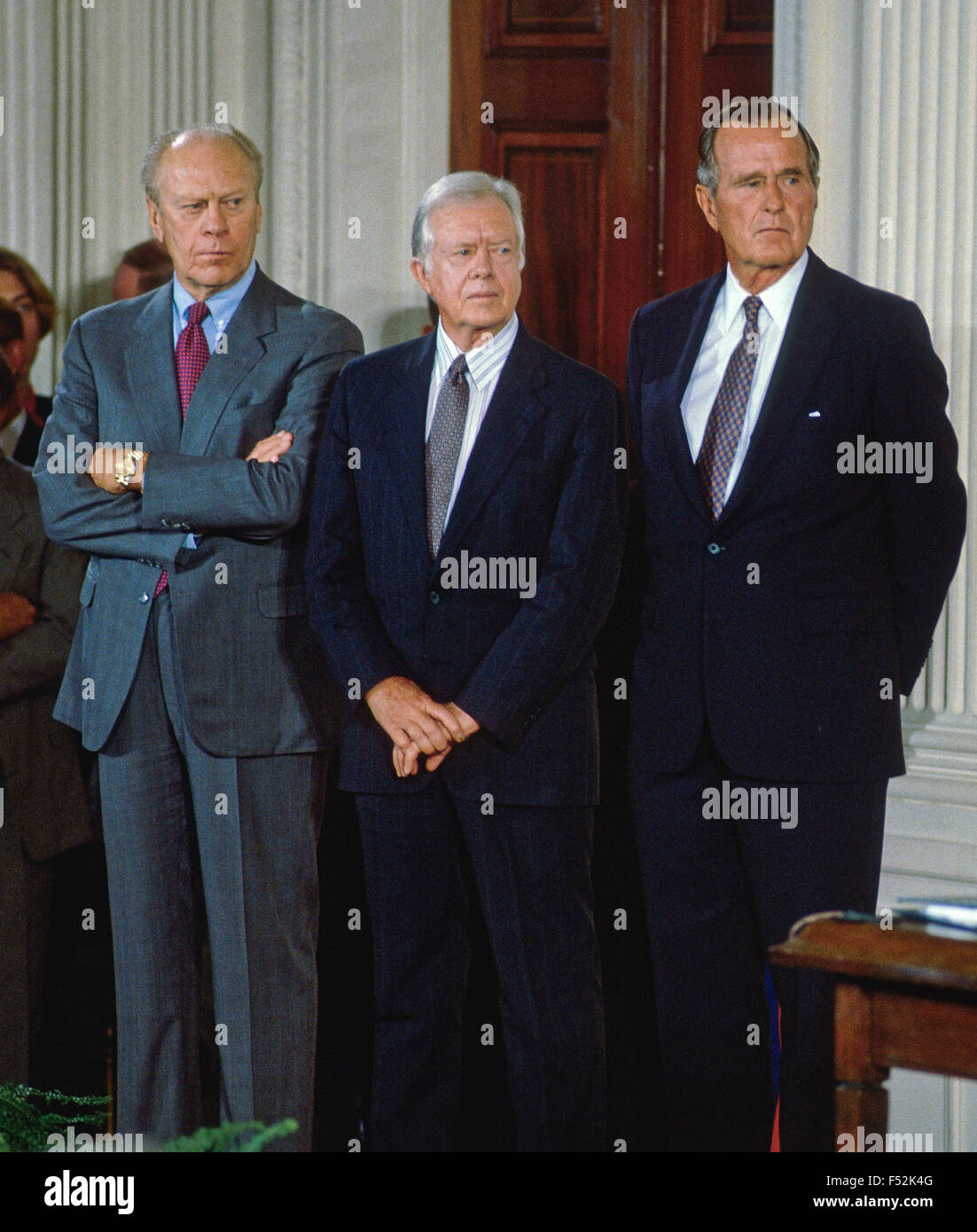 Former Presidents Ford, Carter, and Bush attend the NAFTA signing ceremony in the East room of the White House. Stock Photo