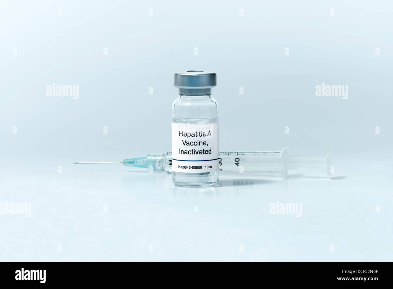 Hepatitis A vaccine in clear vial with syringe. Stock Photo