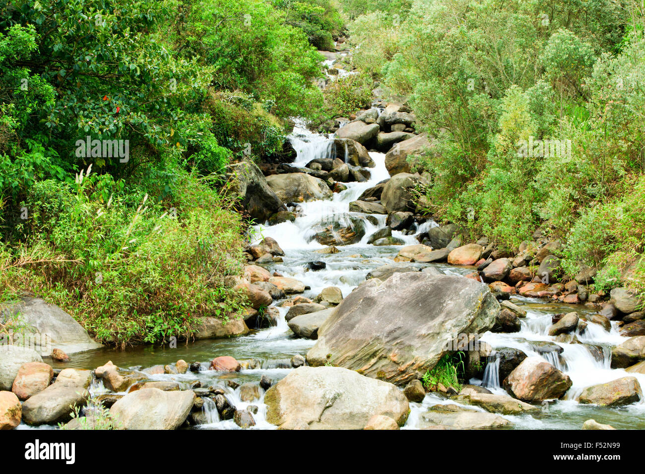 Volcanic Rocks In A Small River Close To Tungurahua Volcano In Ecuador Stock Photo