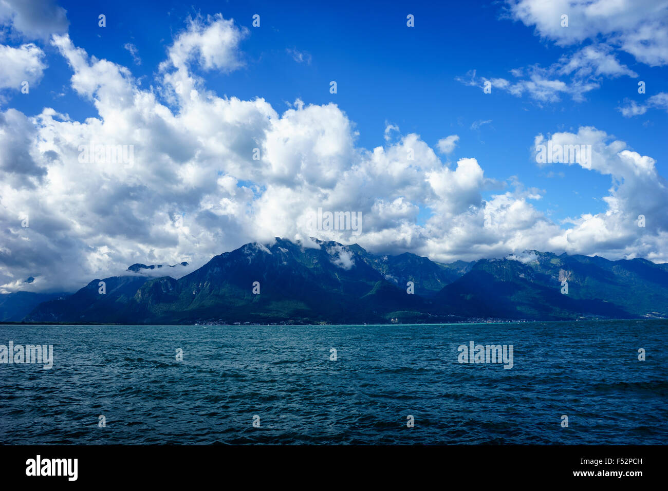 The Swiss Alps mountain range behind Lake Geneva in summer. Lake Geneva, Switzerland. Stock Photo