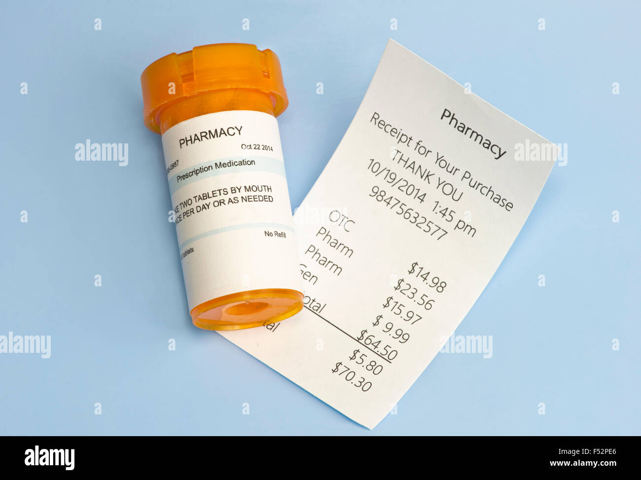 Pharmacy receipt with prescription bottle on blue Stock Photo Alamy