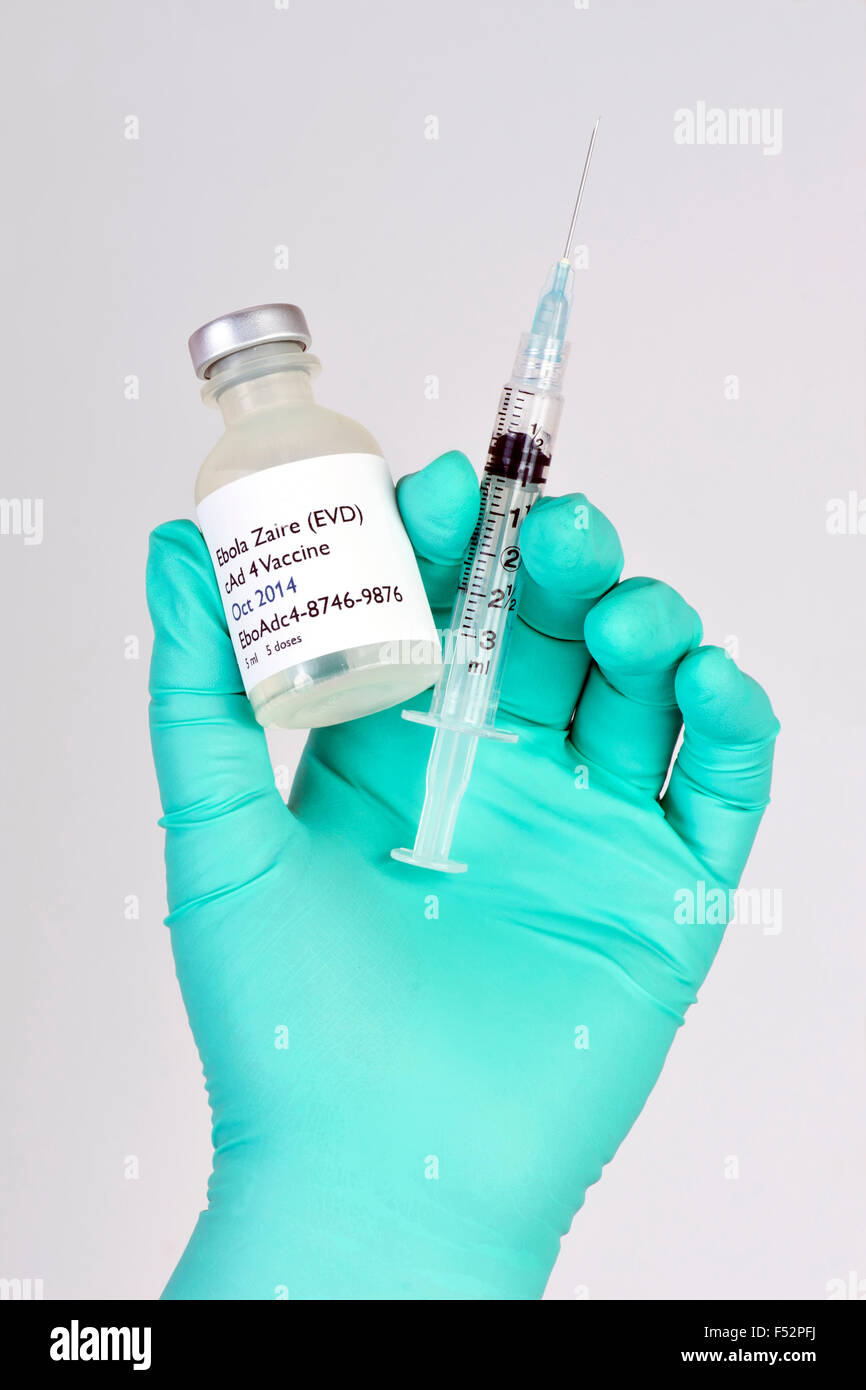 Hypothetical ebola vaccine with syringe in gloved hand. Stock Photo