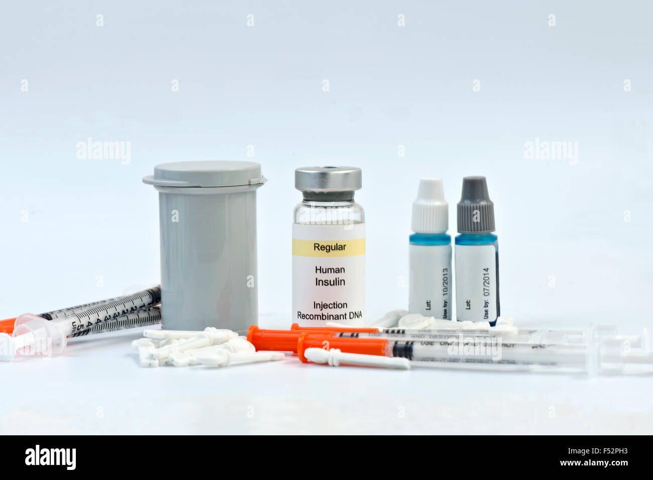 Diabetic testing strips, syringes, lancets, insulin and calibration solutions. Stock Photo