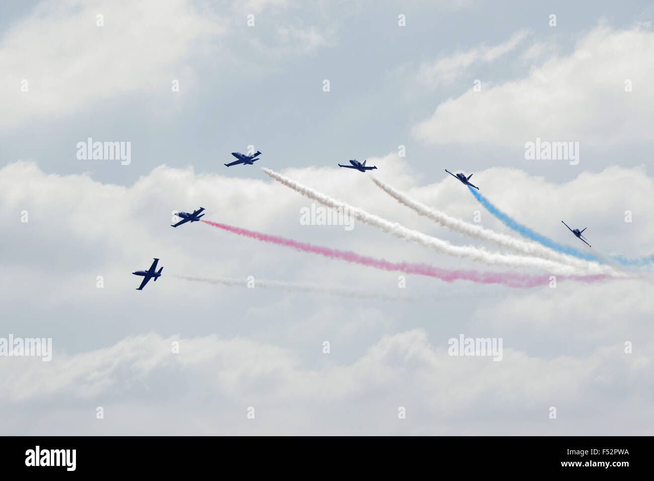 Airplane Patriots Jet Team performing flying formation break at 2015 Miramar Air Show in San Diego, California Stock Photo