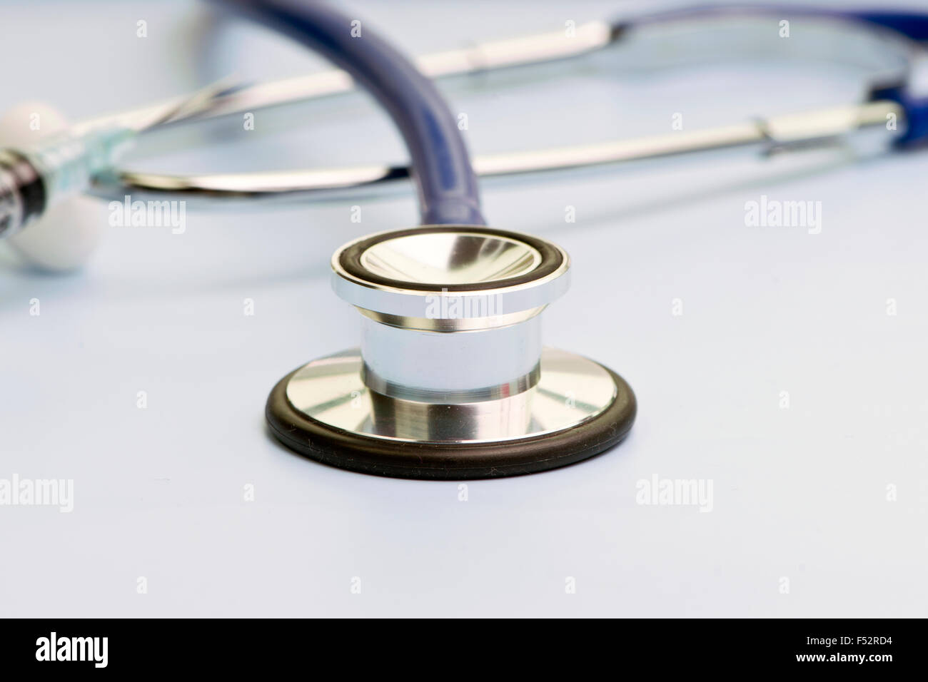 Close Up View Of Stethoscope Bell On Blue Background Stock Photo Alamy