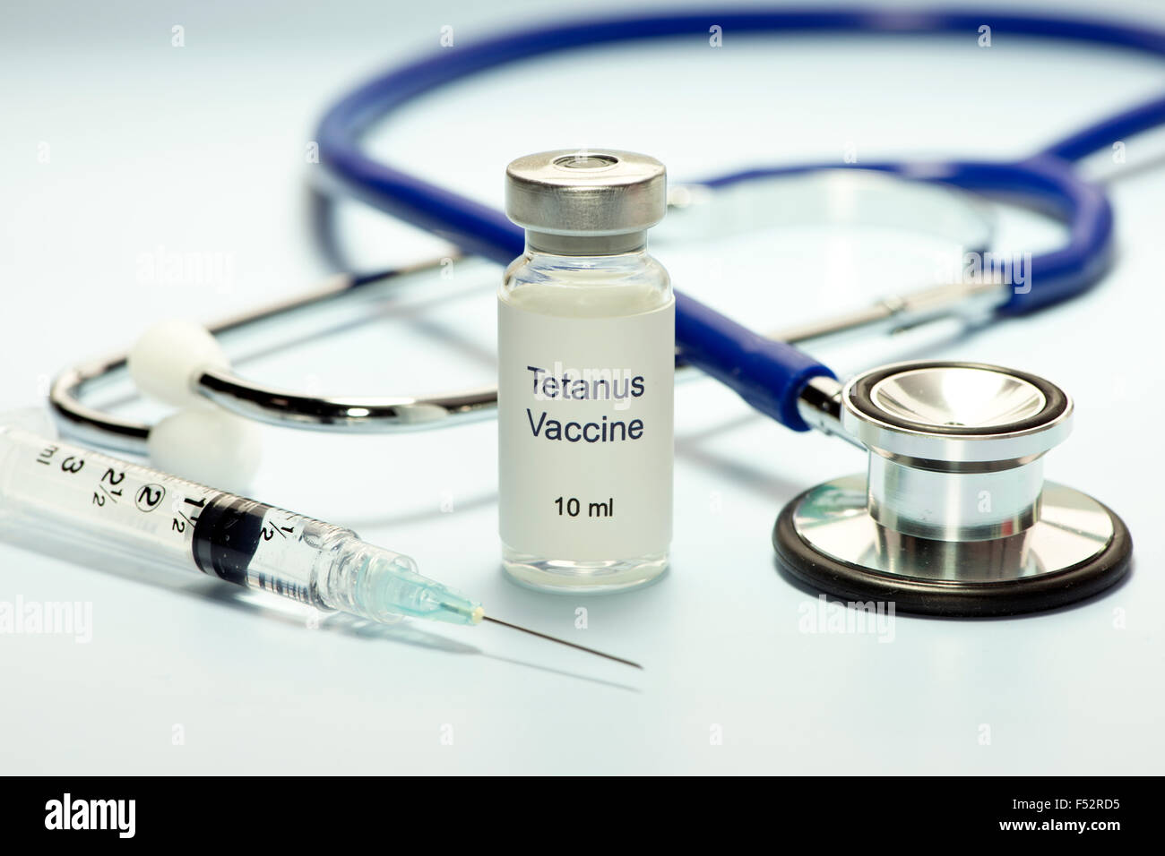 Tetanus vaccine, stethoscope and syringe. Stock Photo