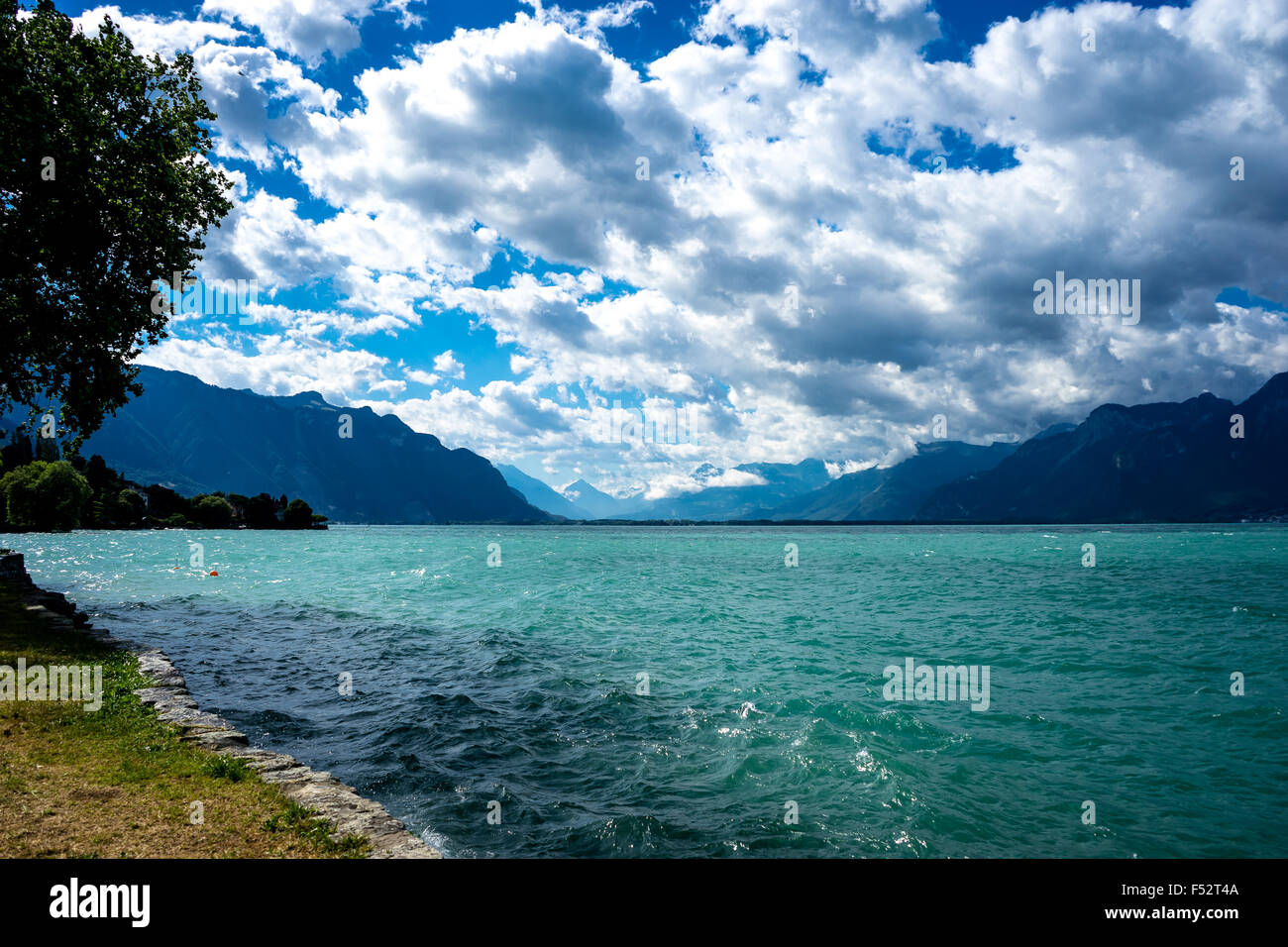 Lake Geneva in summer and the Swiss Alps beyond. Lake Geneva, Switzerland. Stock Photo