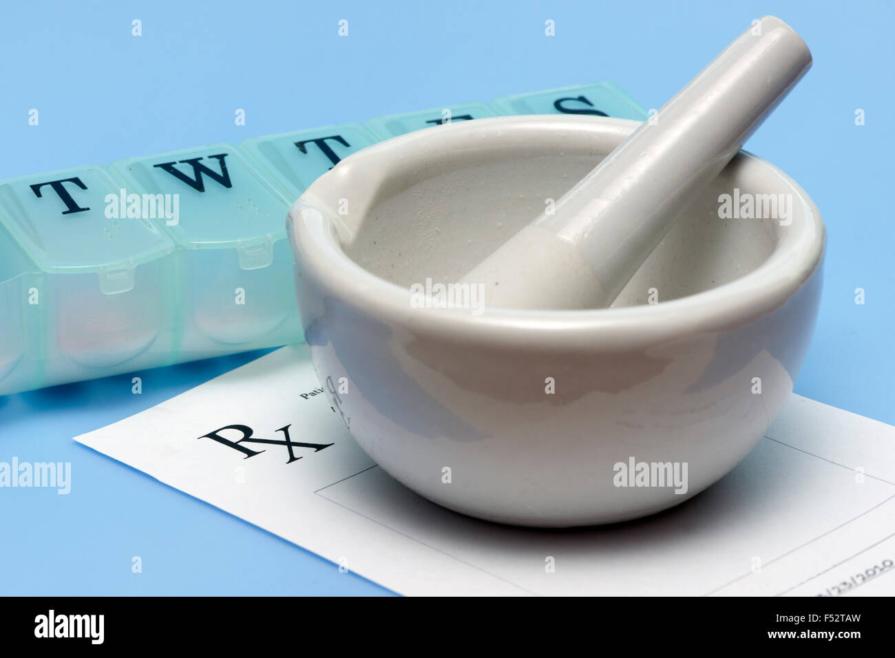 Mortar and pestle with prescription and daily pill dispenser Stock