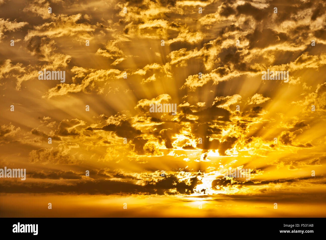 Sunrise with clouds and sunrays. Stock Photo