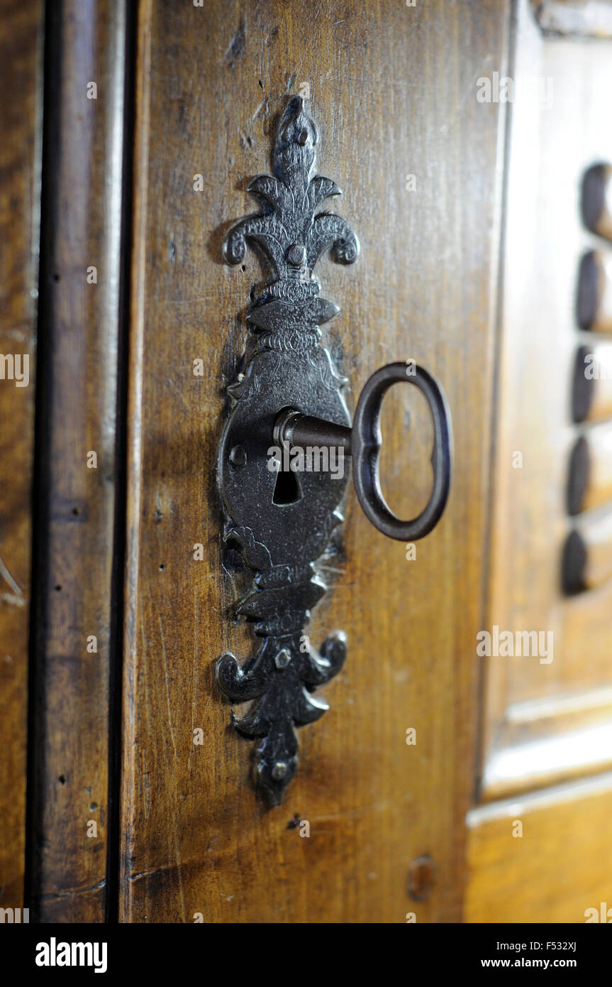 Close-up of an Antique Key in a Lock Stock Photo