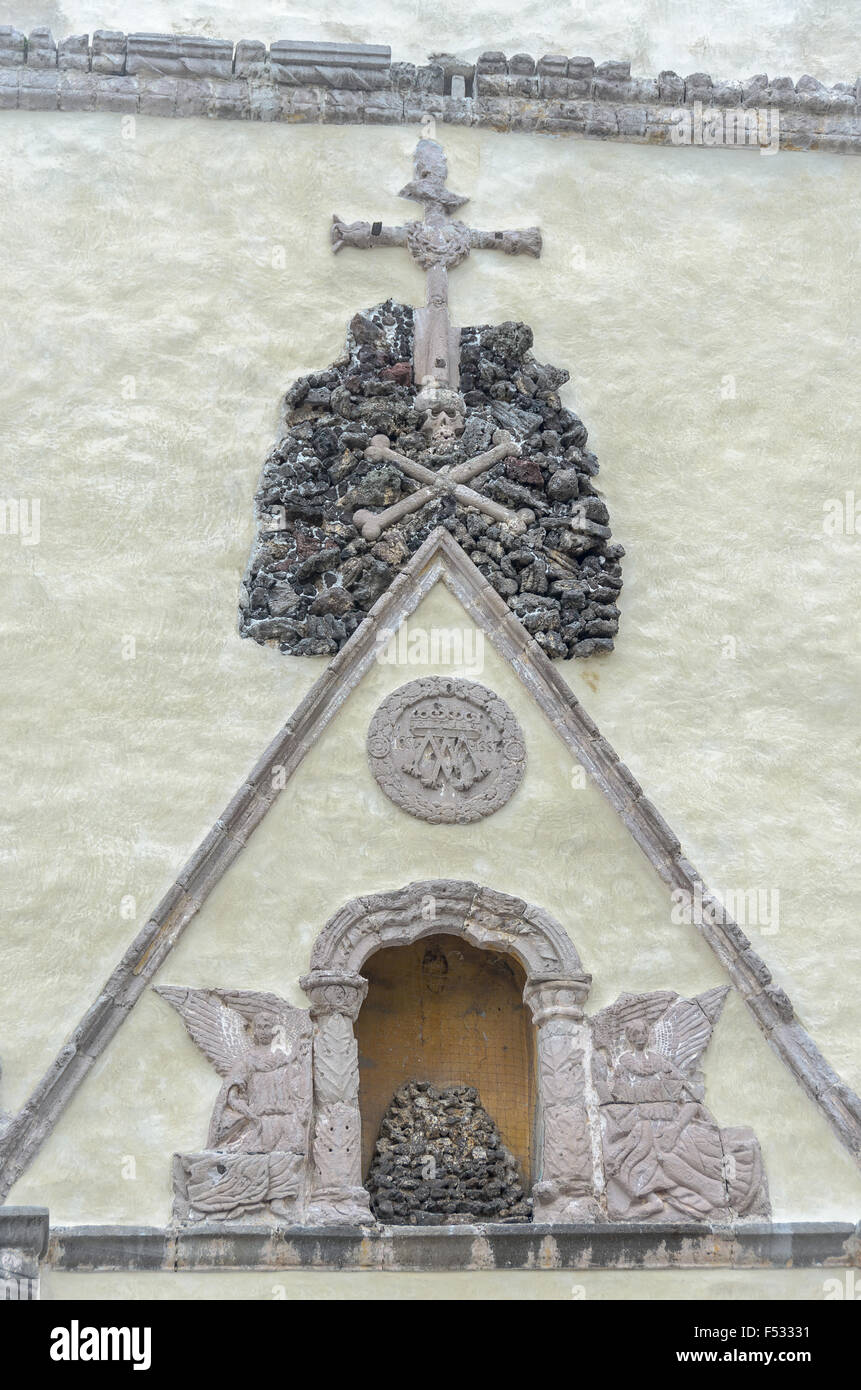 Skull on a pile of stones on which rests a cross. This symbol is located on the side door of the Cathedral of Cuernavaca, repres Stock Photo