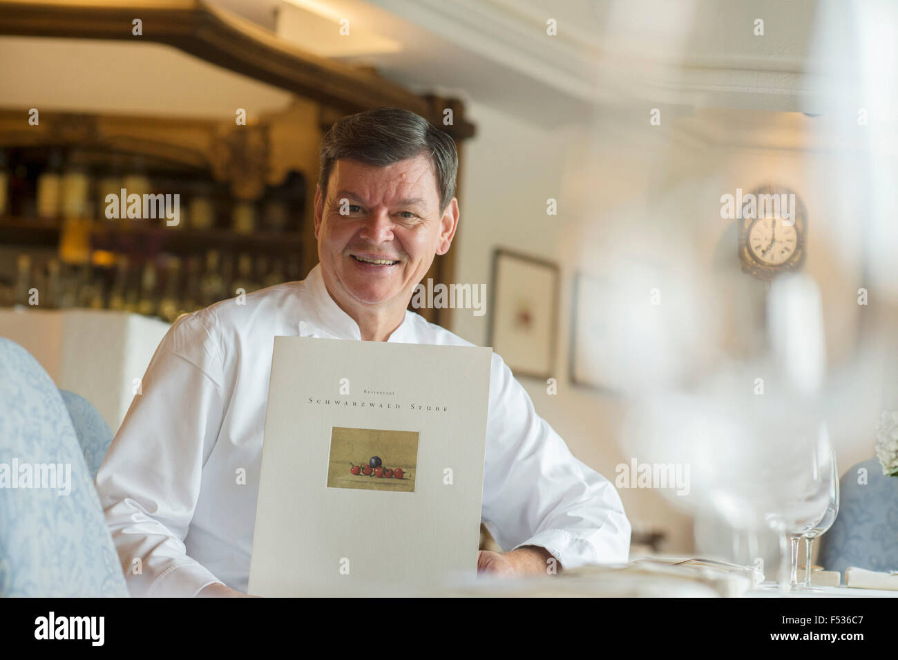 Baiersbronn, Germany. 23rd Oct, 2015. Star chef Harald Wohlfahrt sitting in the kitchen of the Schwarzwaldstube at the Traube-Tonbach hotel in Baiersbronn, Germany, 23 October 2015. PHOTO: ULI DECK/DPA/Alamy Live News Stock Photo