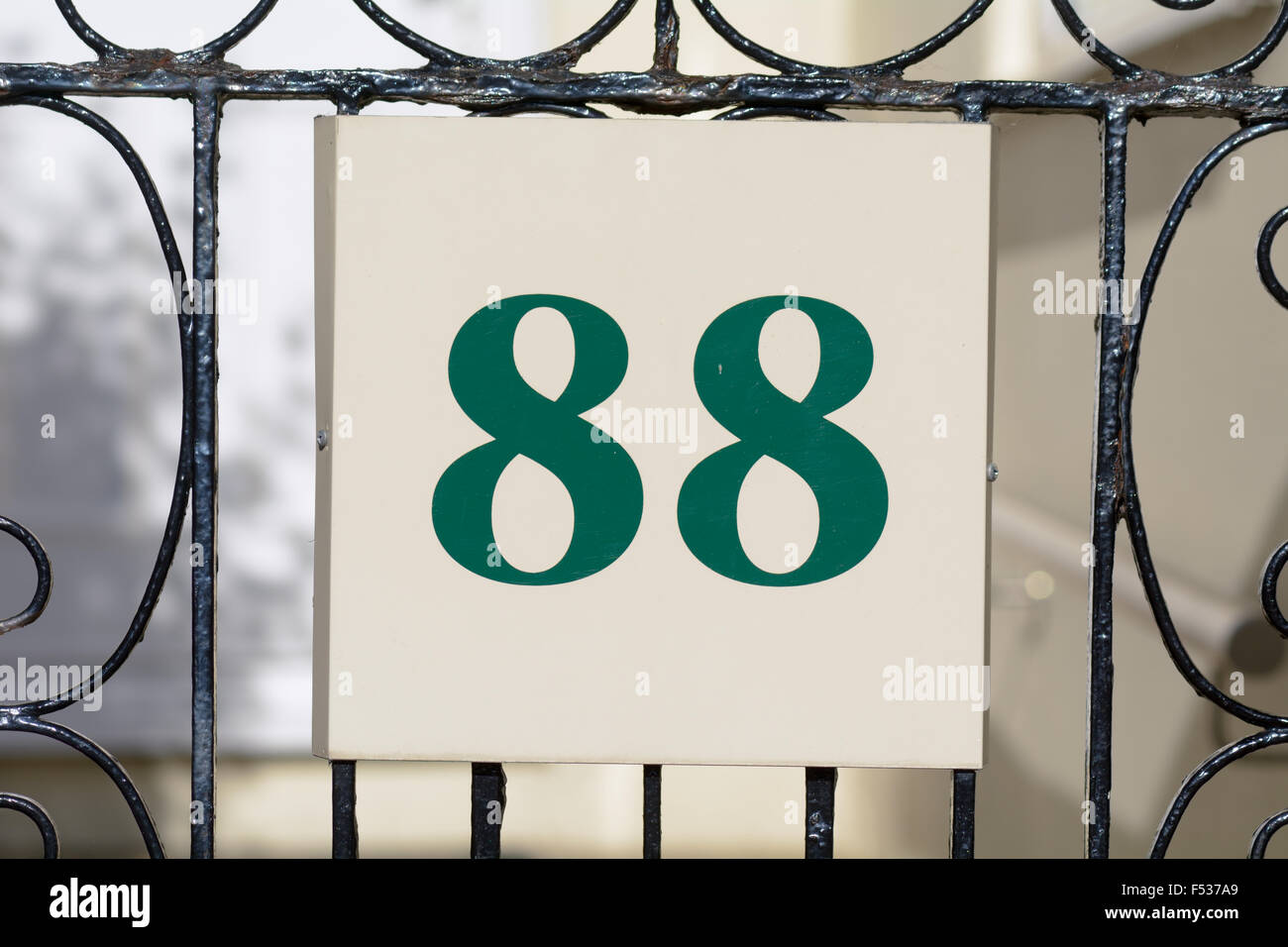House number 88 sign on gate Stock Photo