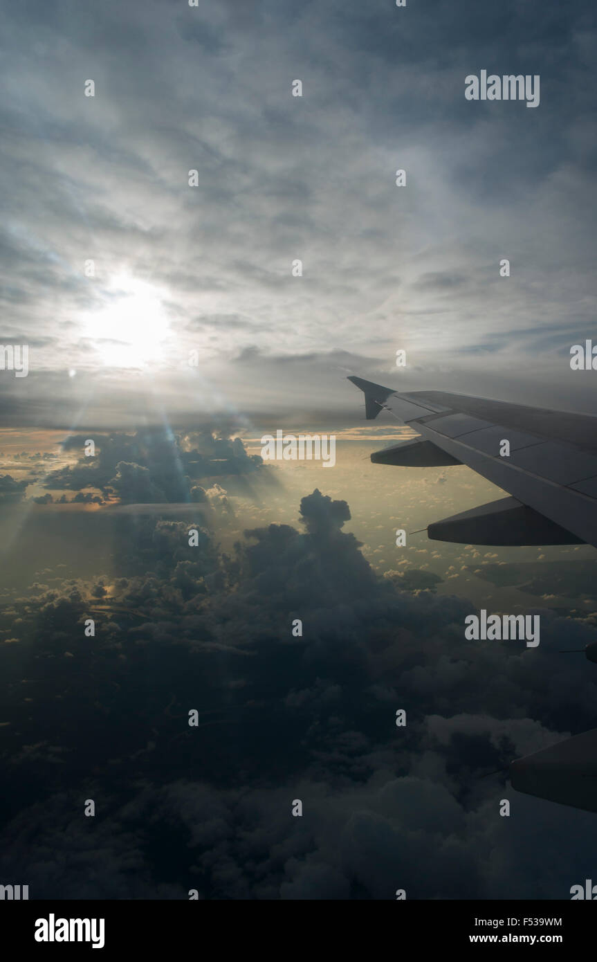 Wing of airplane and at sunset Stock Photo - Alamy