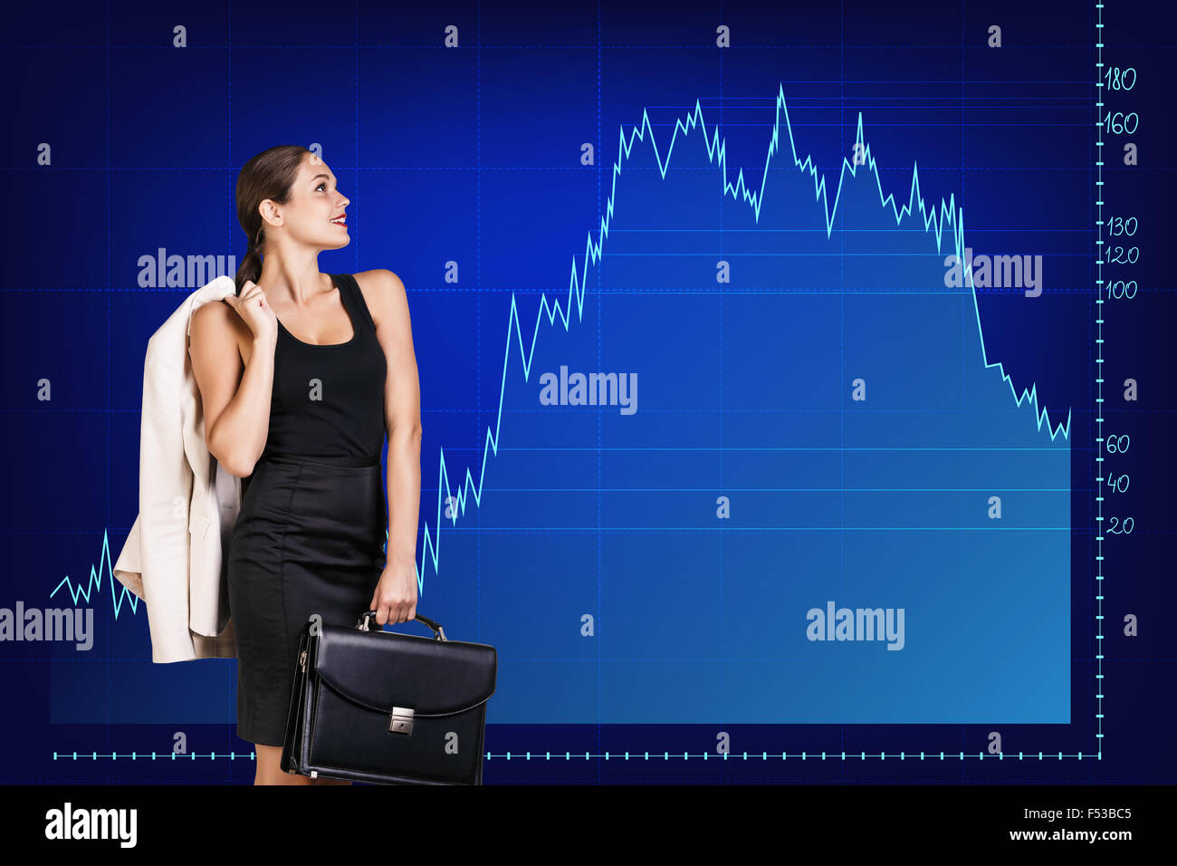 Beautiful business woman stands on the big graph background. Stock Photo
