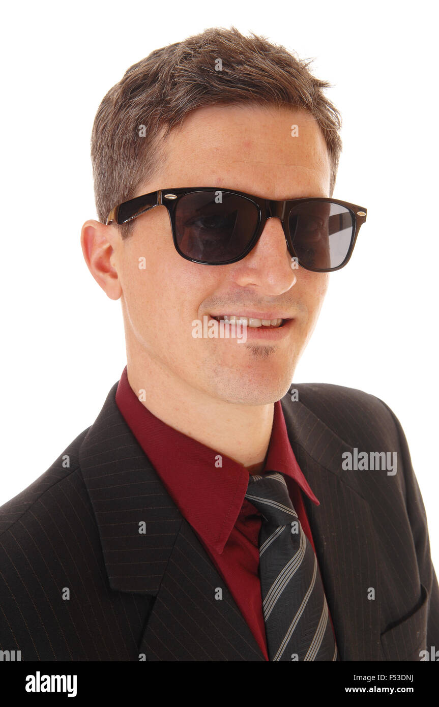 A portrait picture of a young business man in a suit and tie, wearing ...