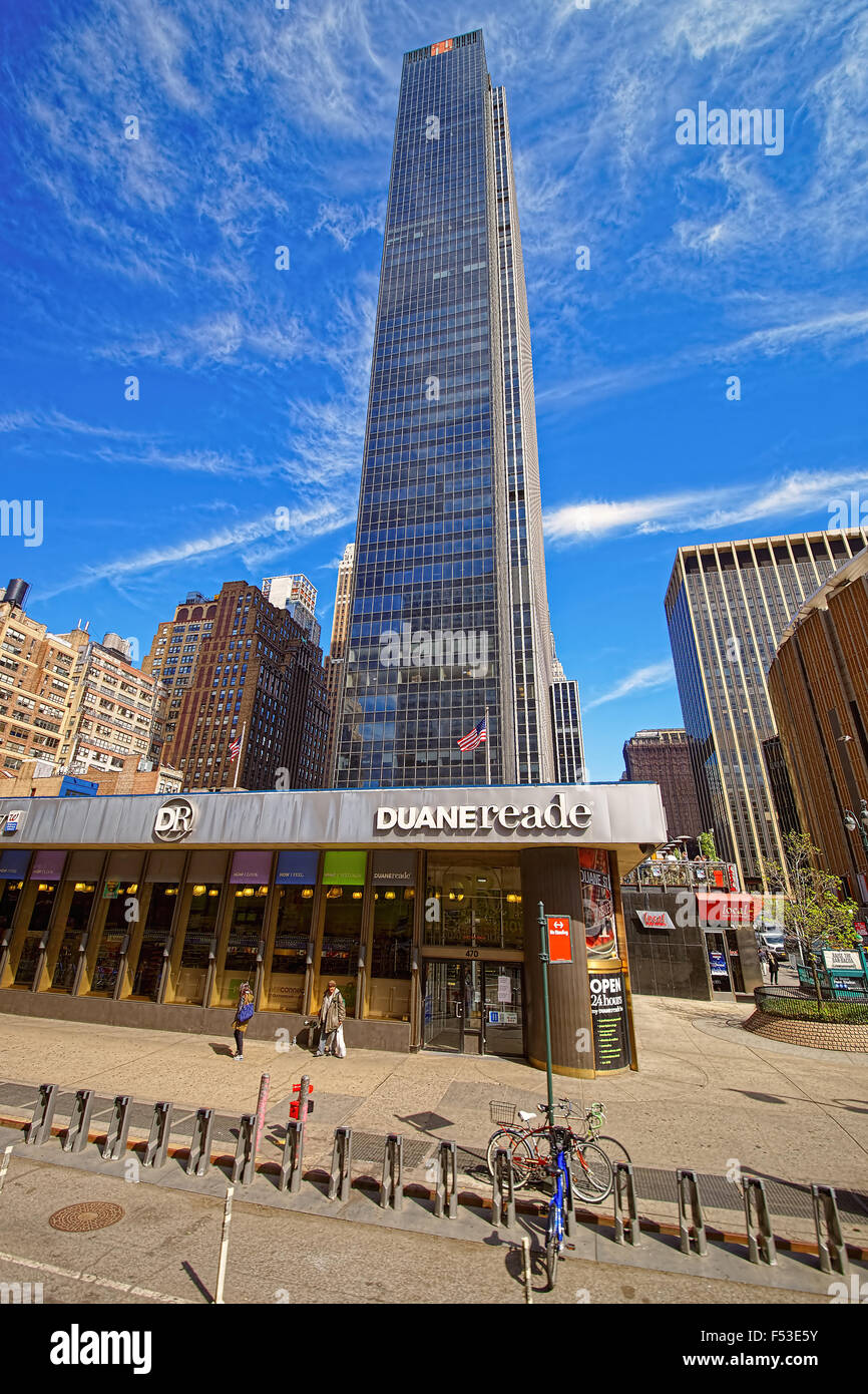 NEW YORK, USA - APRIL 25, 2015: New York City street with shiny skyscrapers in the background and Duane Reade pharmacy store in Stock Photo