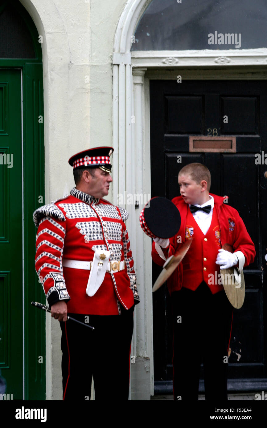 Father and son prepare for the Apprentice Boys of  Derry parade. Stock Photo