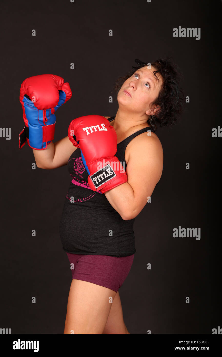 Thirty's woman boxer posing in the photo studio, September 2015 Stock Photo