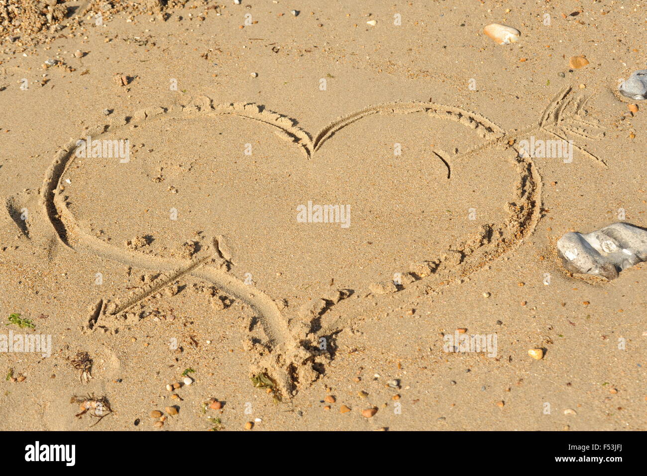Heart Shape Drawn in the sand Stock Photo