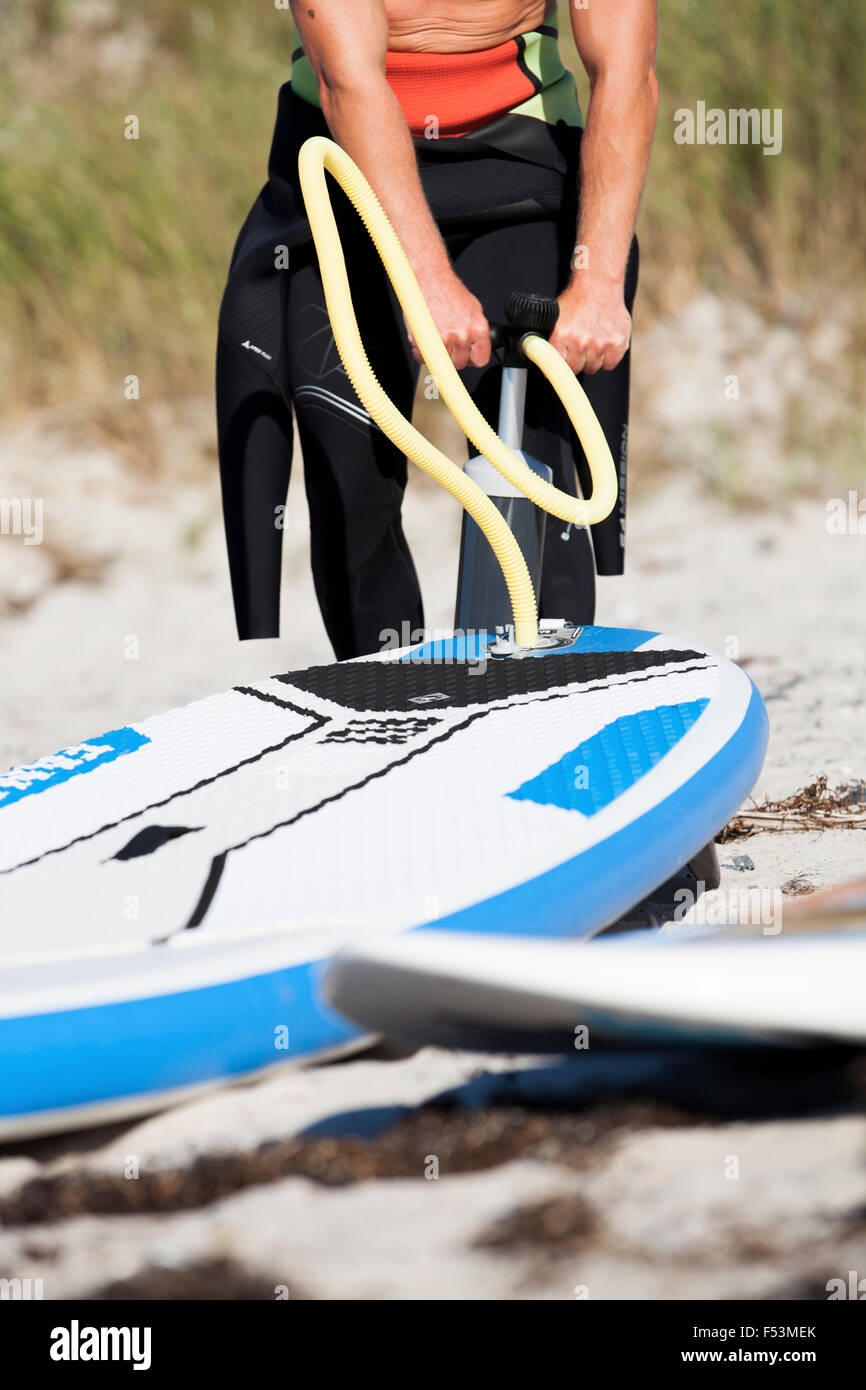 Pump up a SUPBoard Stock Photo Alamy