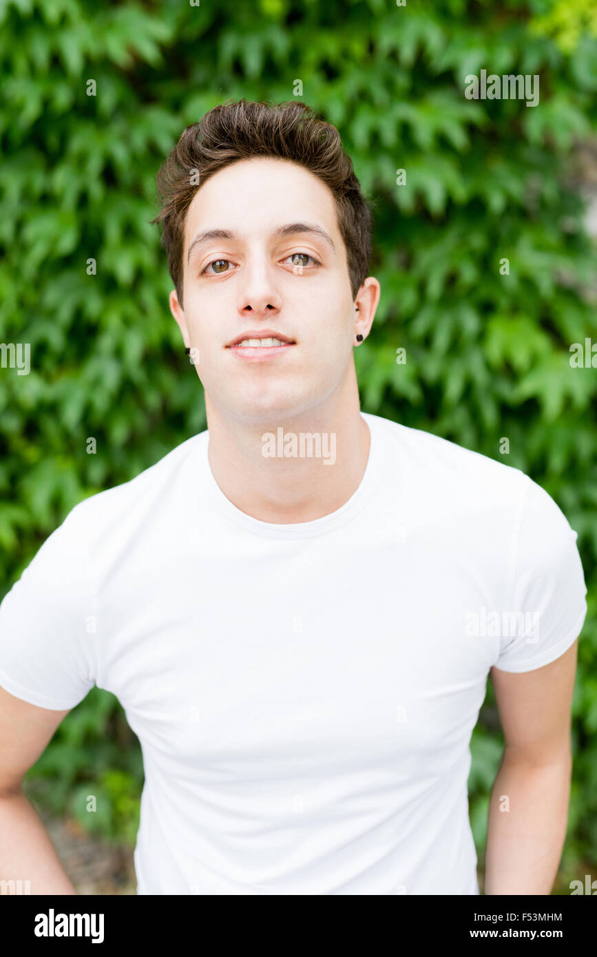 Half length of young handsome caucasian brown hair man looking in camera, smiling - freshness, youthful, carefreeness concept Stock Photo