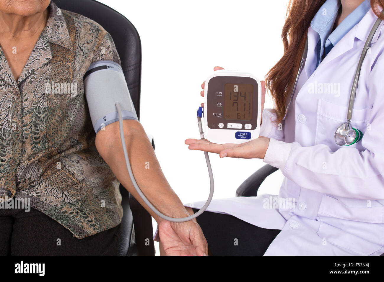 close-up of Female doctor measuring blood pressure of senior woman ...
