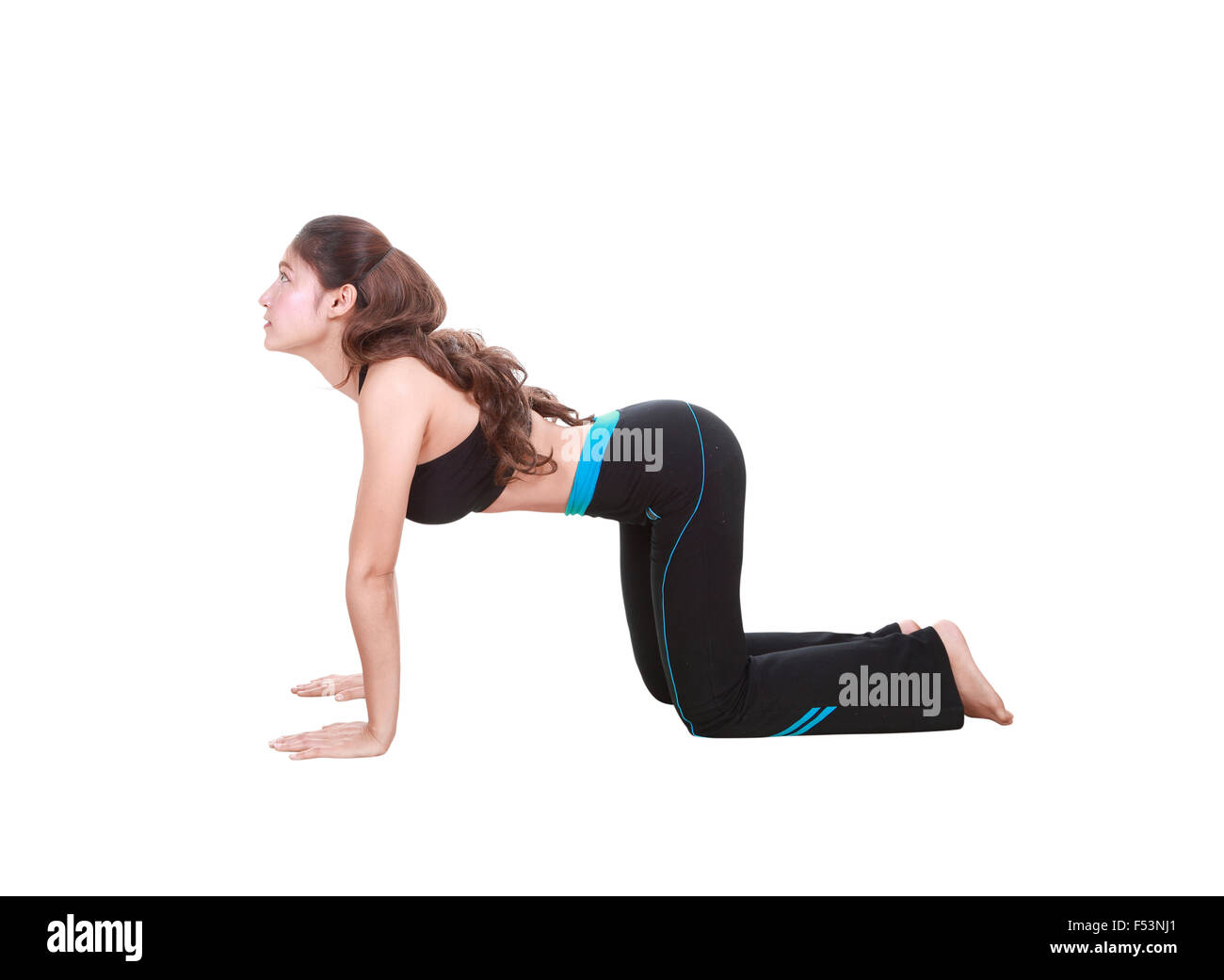 Young woman doing yoga exercise isolated on white background Stock ...