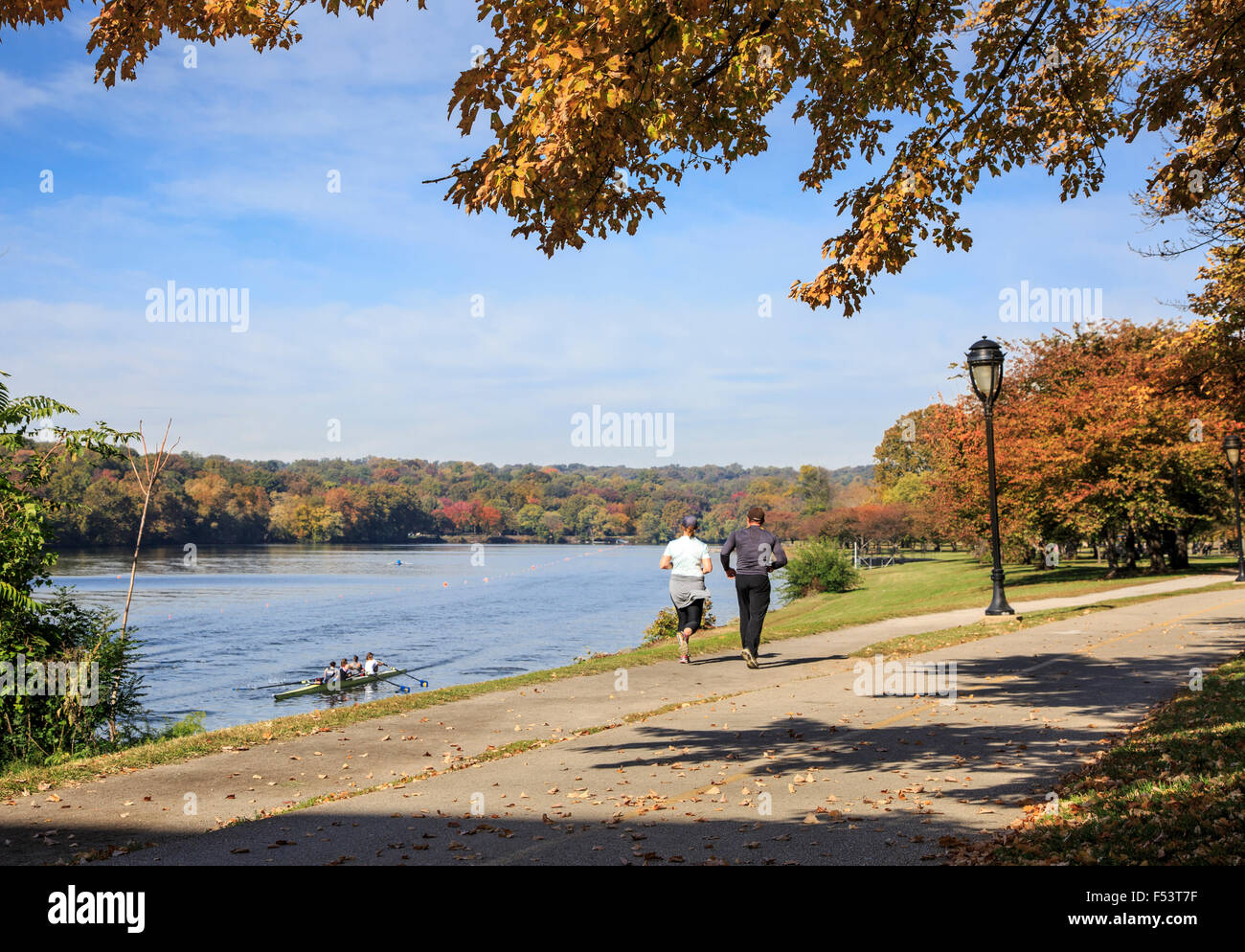 Fairmount Park in Autumn along the Schuylkill River near Girard Bridge with runners and rowers  , Philadelphia, Pennsylvania Stock Photo