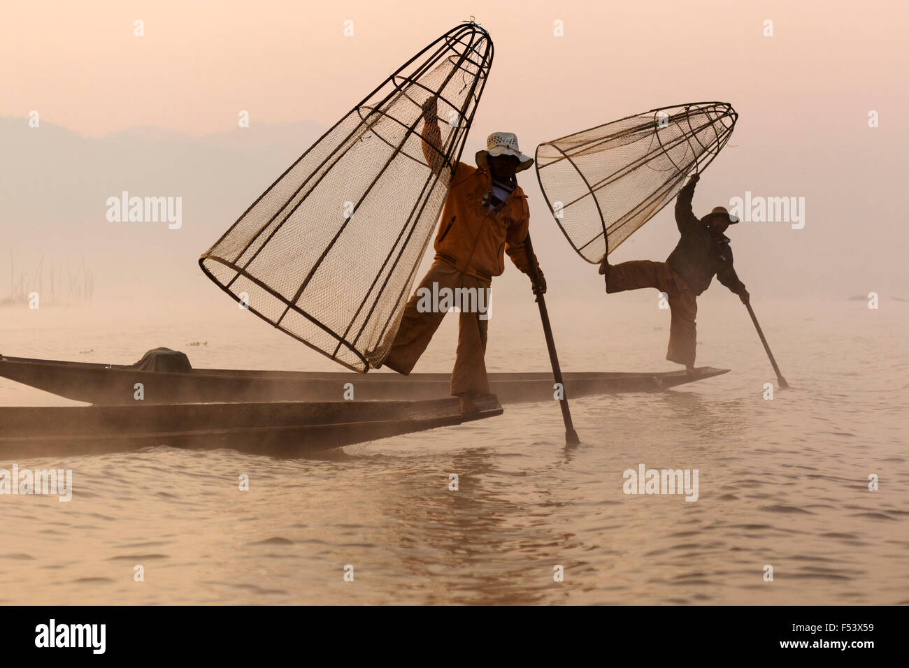 Fishermen rowing with one leg, Inle Lake, Myanmar Stock Photo