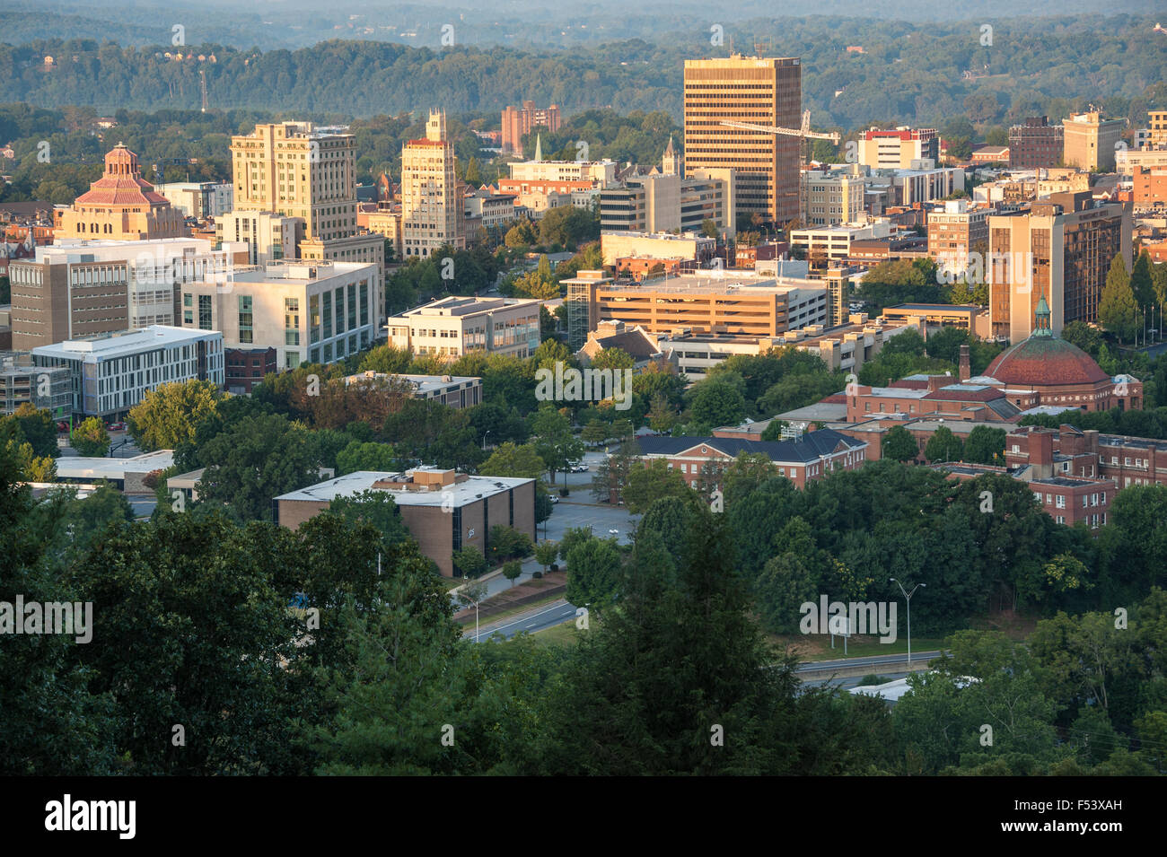 Sunrise lights the city of Asheville, North Carolina, nestled in the Blue Ridge Mountains. USA. Stock Photo