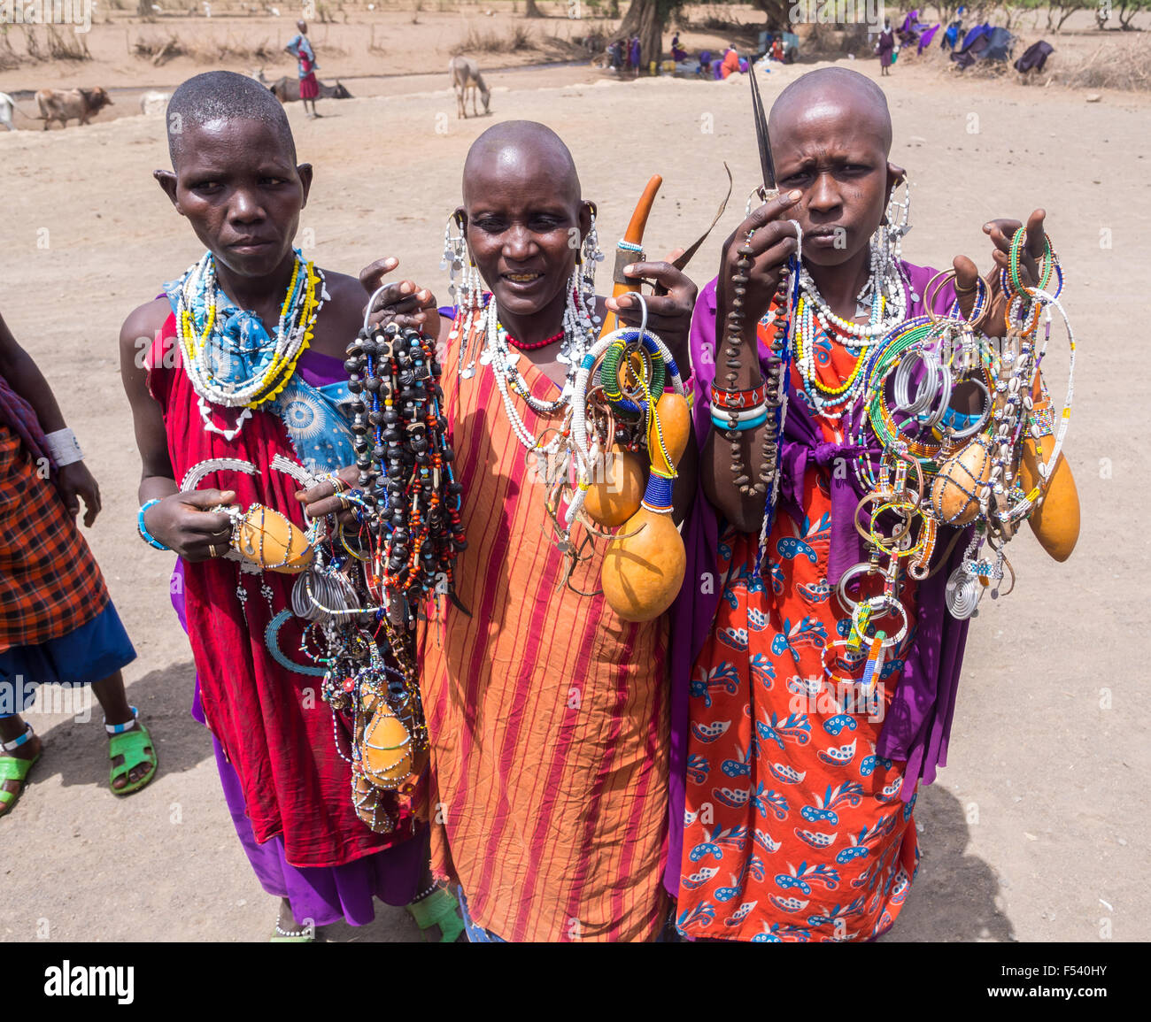 Maasai women offering souvenirs (mainly traditional jewelry) to the tourists in Arusha region, Tanzania, Africa. Stock Photo