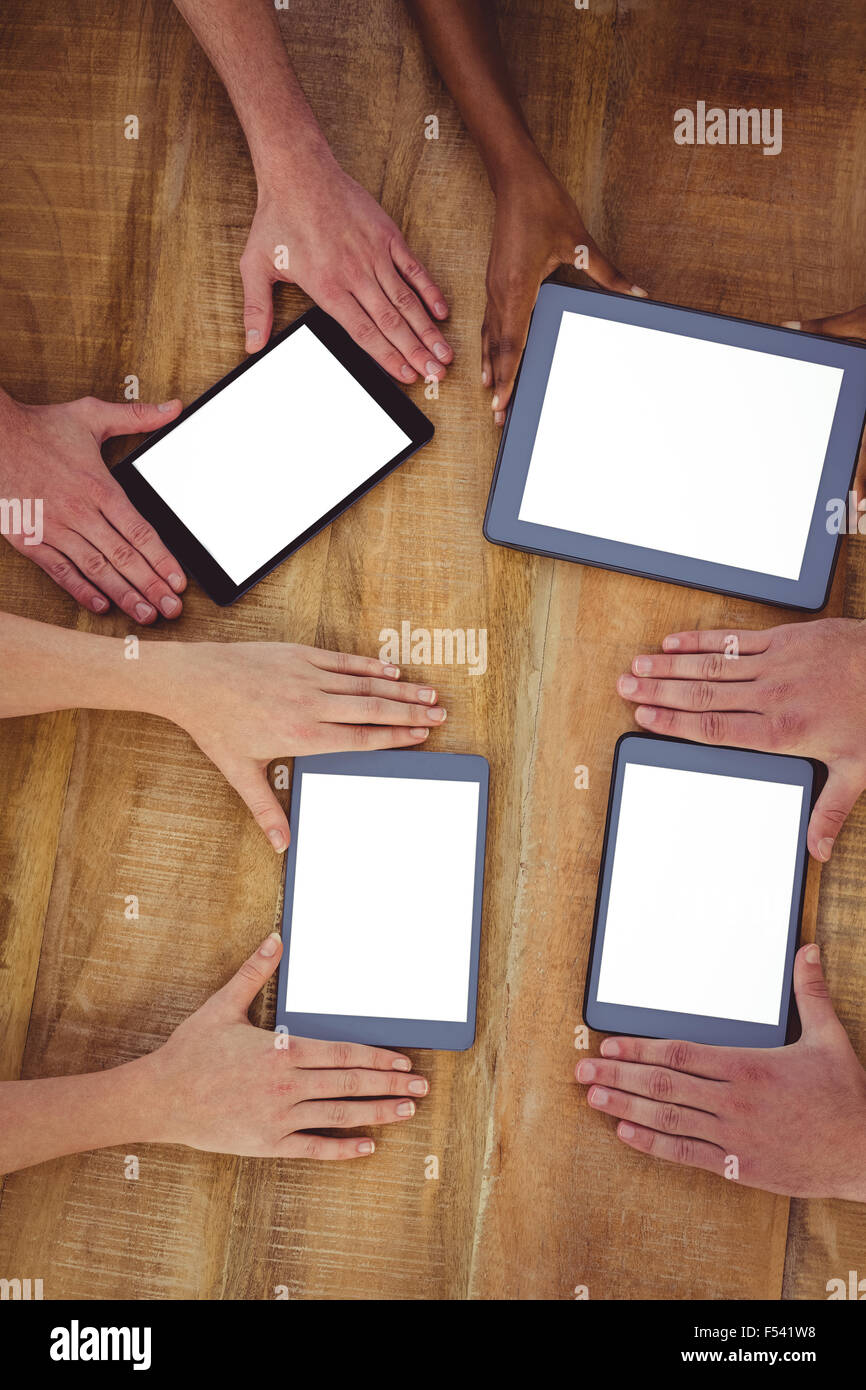 Creative team working together on a tablet and smartphones Stock Photo ...