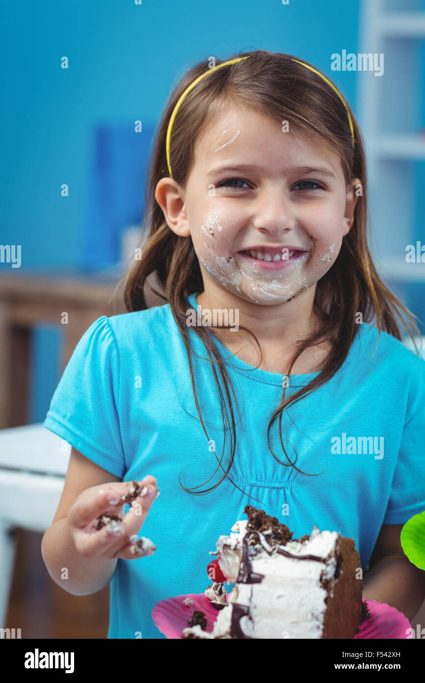 Happy kid eating birthday cake Stock Photo