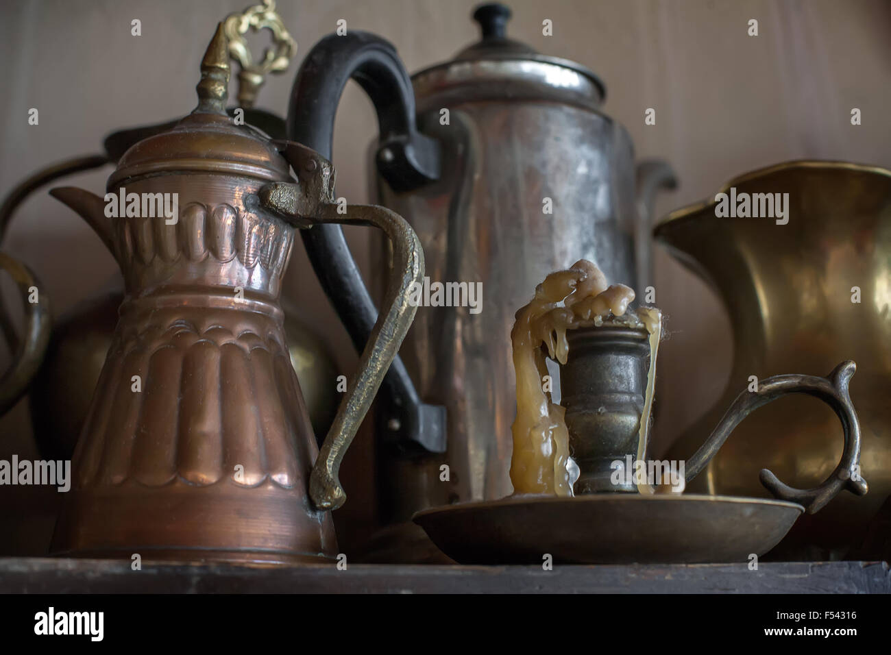 Old oriental teapots and candlestick Stock Photo Alamy