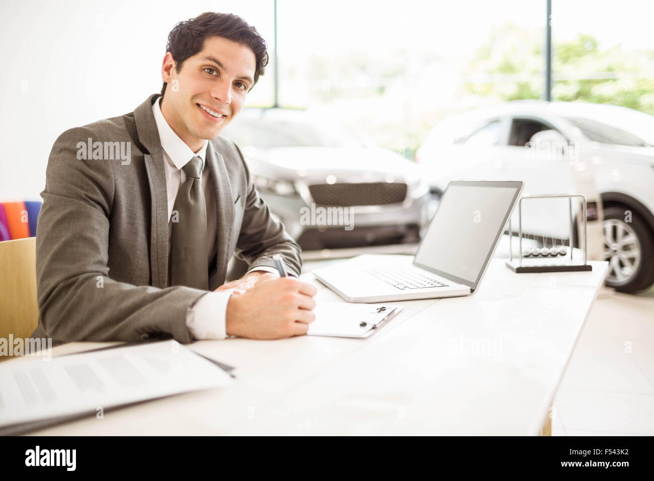 Car salesman sitting desk in hires stock photography and images Alamy
