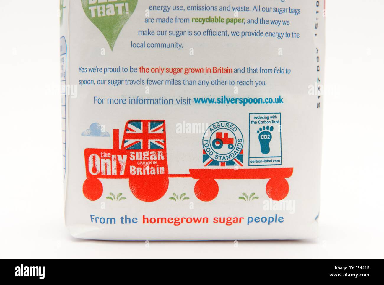 A 1 kilo bag of sugar detailed close up of assured food standards agency logo and only sugar grown in Britain farm tractor Stock Photo