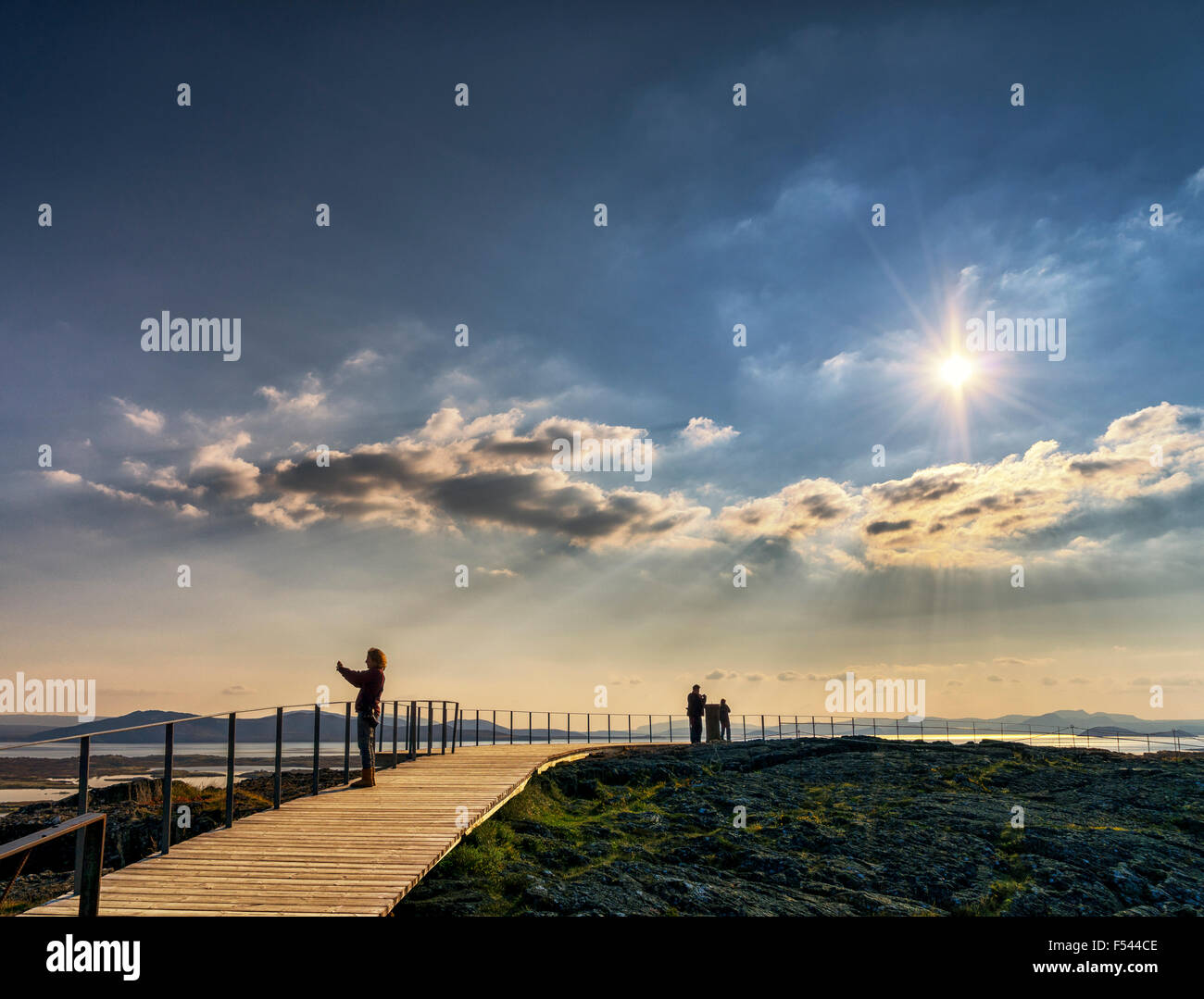 Tourist taking pictures of Lake Thingvellir at Thingvellir National Park, Iceland Stock Photo