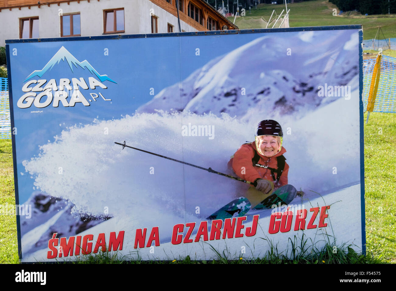 Woman posing as a skier in a skiing poster for Czarna Gora (Black Mountain) ski resort in Snieznicki Park Krajobrazowy. Poland Stock Photo