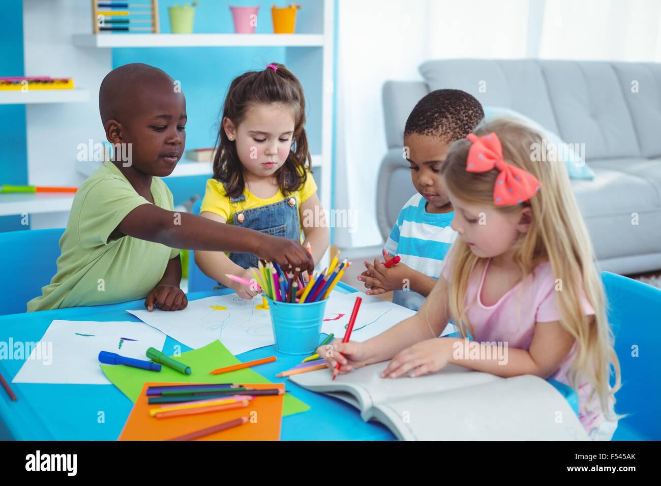 Happy kids enjoying arts and crafts together Stock Photo