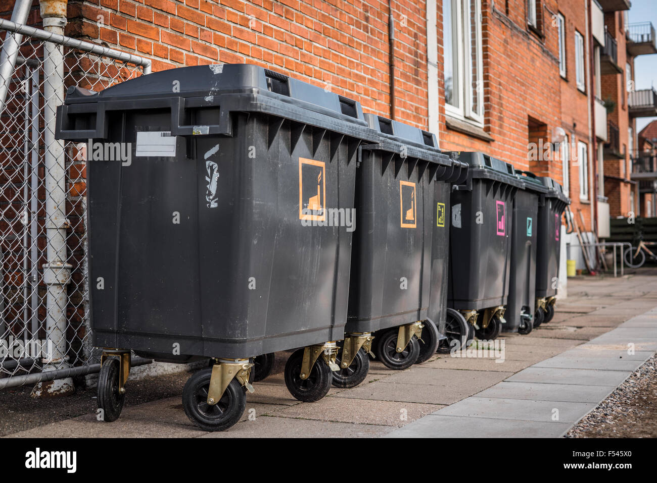 Garbage cans for waste sorting outside a house Stock Photo Alamy