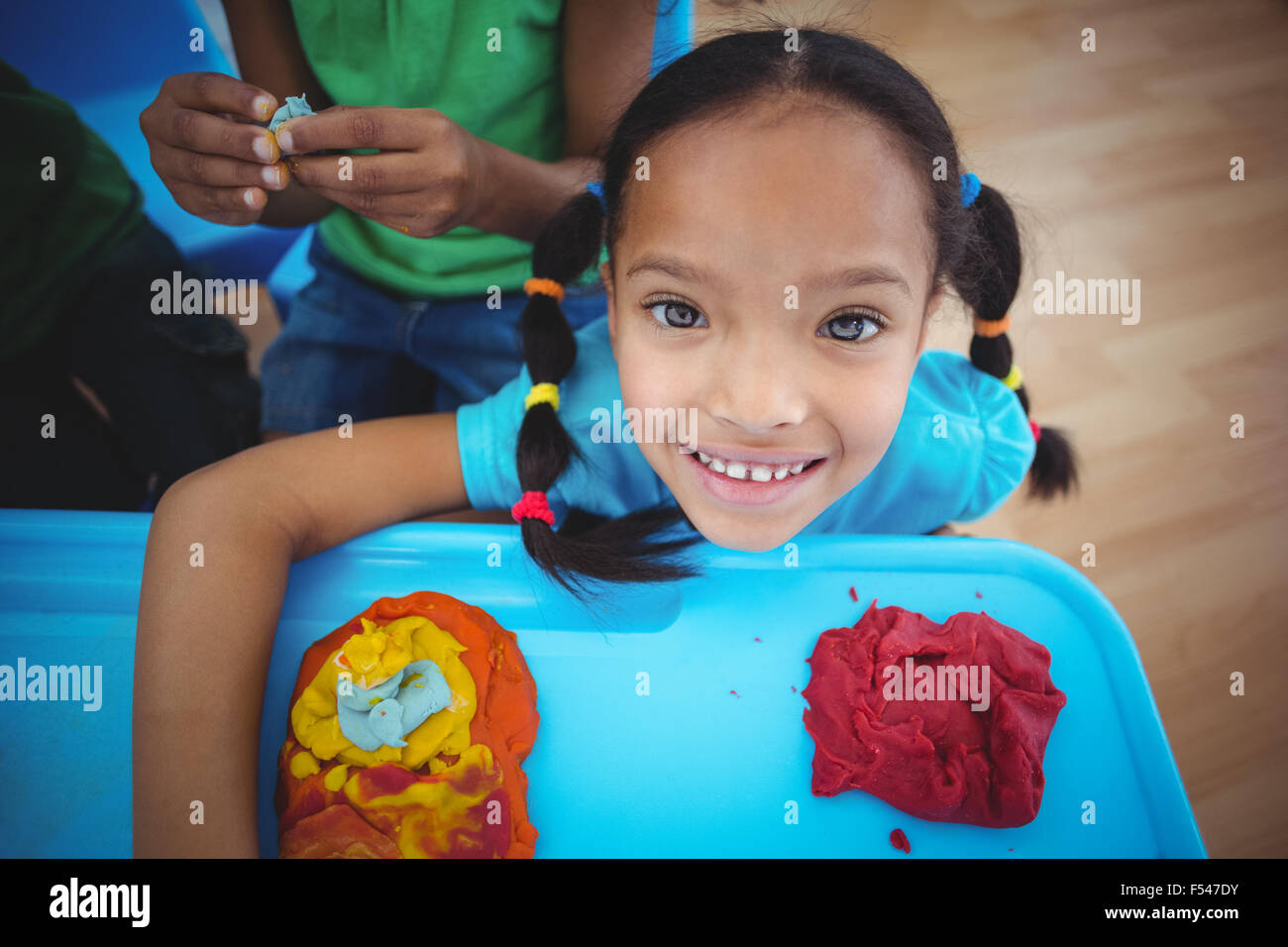 Smiling girl looking at the camera Stock Photo - Alamy