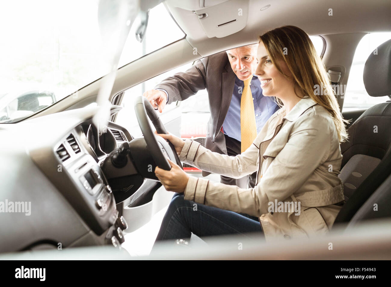 Salesman showing somethings to a customer Stock Photo