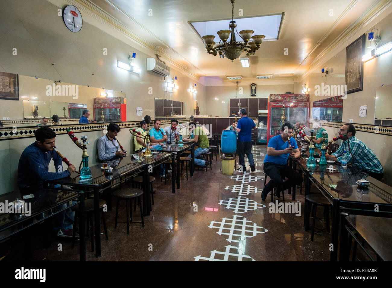 Men smoke qalyan and drink tea in Tehran, Iran Stock Photo