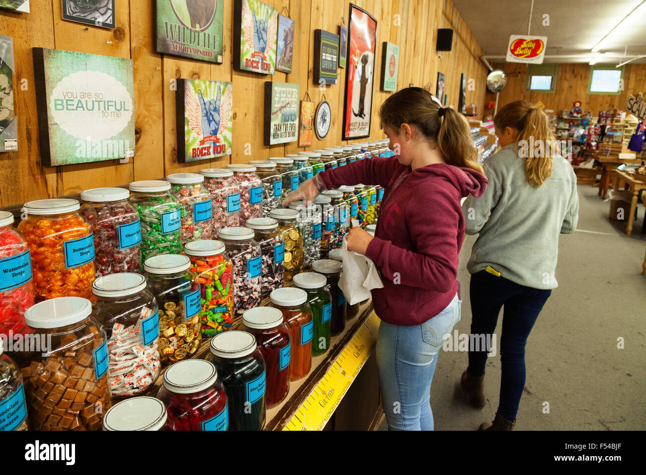 Teenagers shopping and buying sweets, Chutters candy store, Littleton, New Hampshire USA Stock Photo