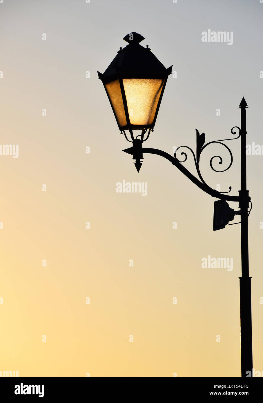 Street antique style lamp post with effect of shine from low light of