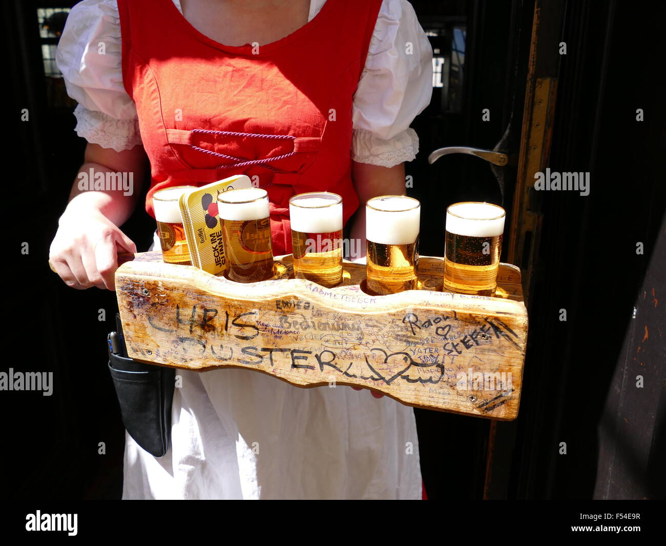 Europe Germany Cologne Köln waitress holding beer tray Stock Photo