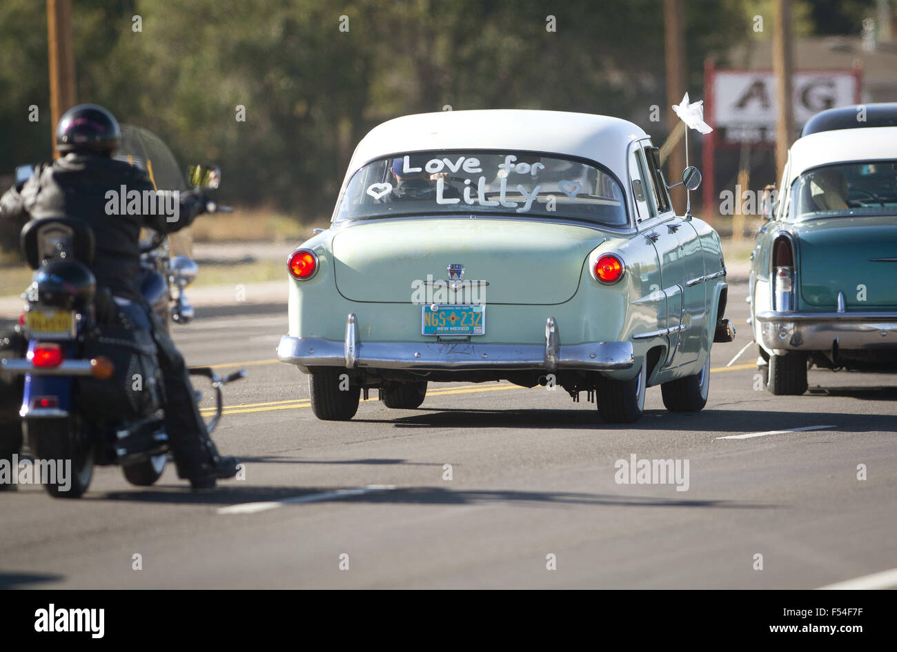 Usa. 27th Oct, 2015. 102715.After the funeral of four-year-old Lilly Garcia at Nativity of the Blessed Virgin Mary Church, cars in the processional, headed to Sunset Memorial Park for the graveside service, drove with the message Love for Lilly, Tuesday, Oct. 27, 2015, in Albuquerque, N.M. Lilly was shot and killed on the freeway as the result of road rage. © Albuquerque Journal/ZUMA Wire/Alamy Live News Stock Photo